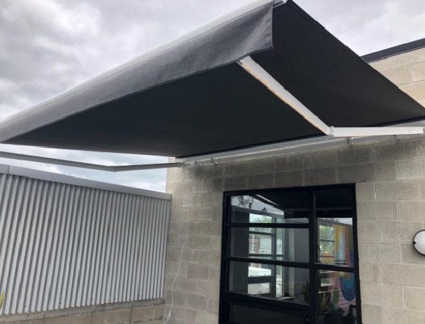 Commercial retractable awnings - customer service window - Marygrove Awnings