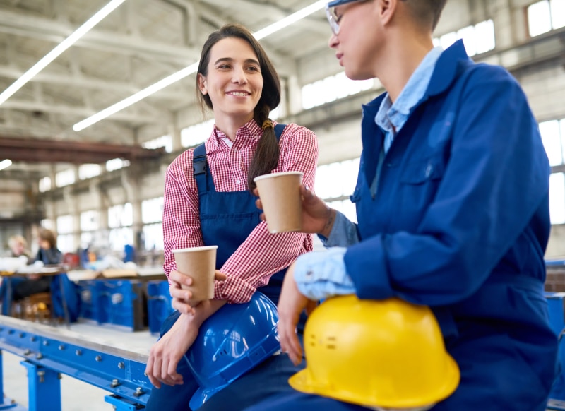 Two Employees Enjoying Cup of Coffee