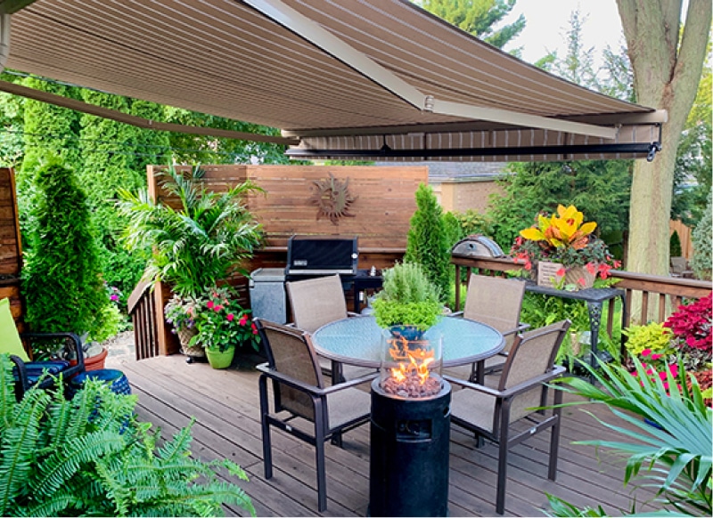 Tan retractable awning over deck