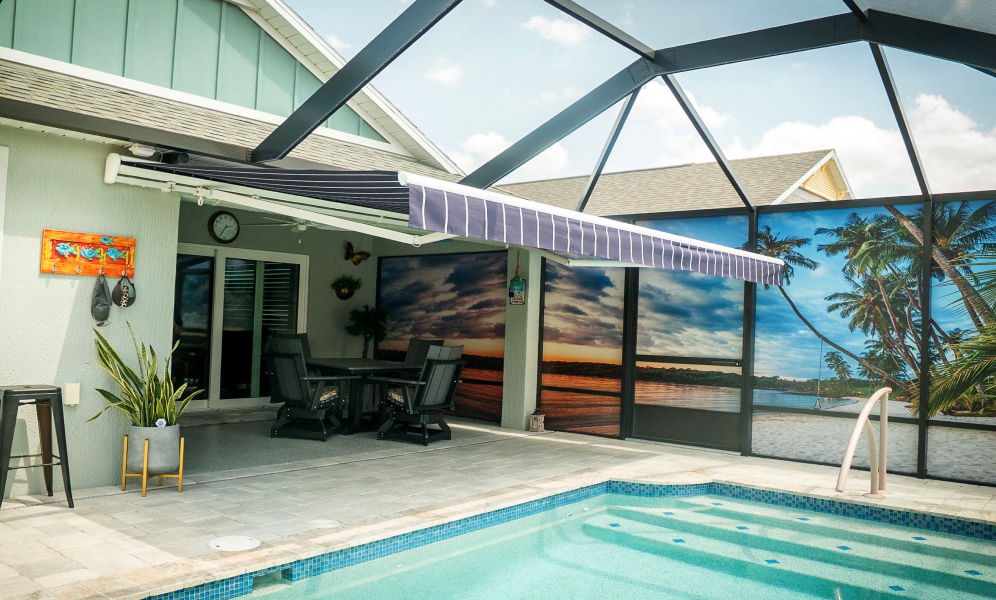 awning inside of bird cage next to inground pool