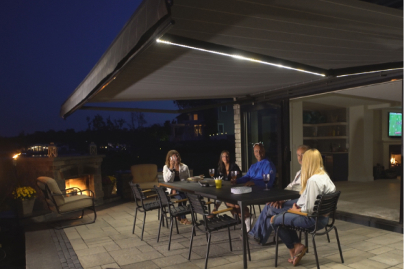 people sitting underneath an awning with LED Lights on