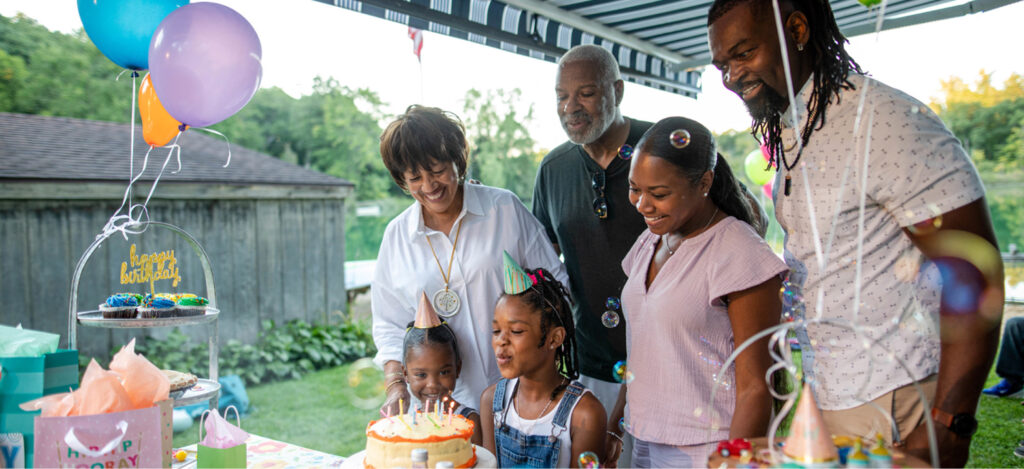 small birthday party underneath an awning