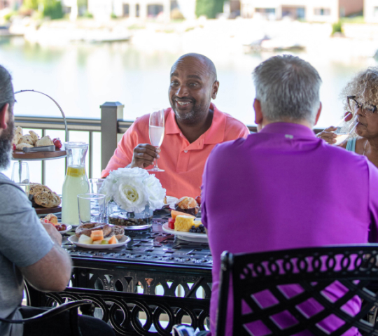 adults talking across table