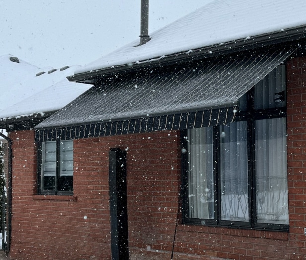 durable awning being used in the snow